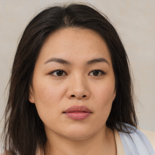 Neutral asian young-adult female with medium  brown hair and brown eyes
