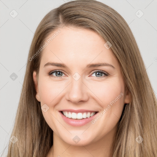 Joyful white young-adult female with long  brown hair and grey eyes