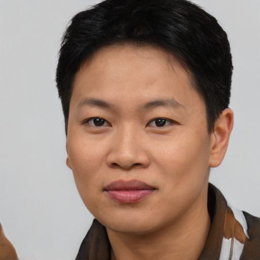 Joyful asian young-adult female with short  black hair and brown eyes
