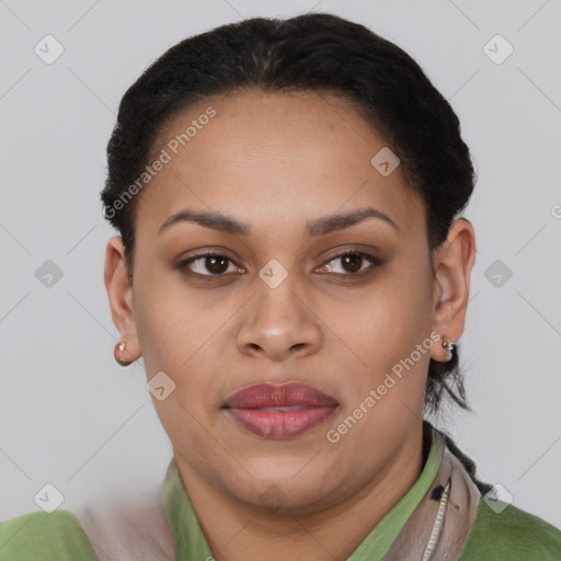 Joyful latino young-adult female with short  brown hair and brown eyes