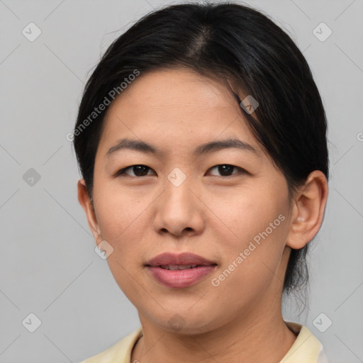 Joyful asian young-adult female with medium  brown hair and brown eyes