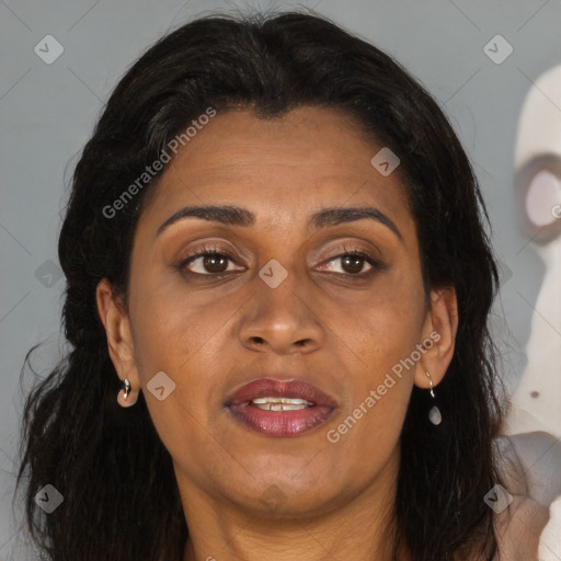 Joyful black adult female with medium  brown hair and brown eyes