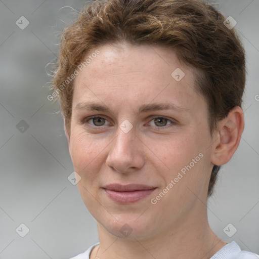 Joyful white young-adult female with short  brown hair and grey eyes