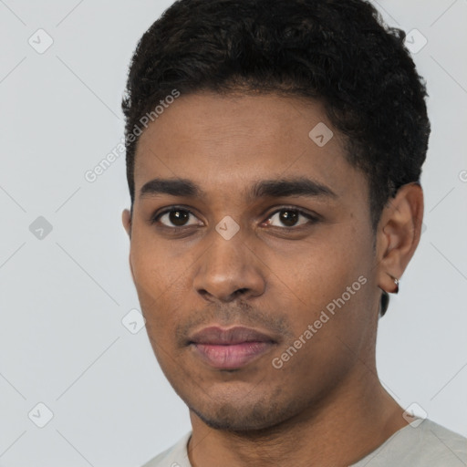 Neutral black young-adult male with short  black hair and brown eyes