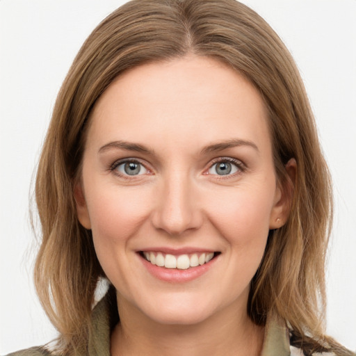 Joyful white young-adult female with medium  brown hair and grey eyes