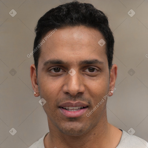 Joyful white young-adult male with short  black hair and brown eyes