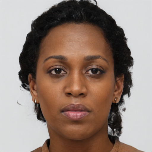Neutral black young-adult female with short  black hair and brown eyes