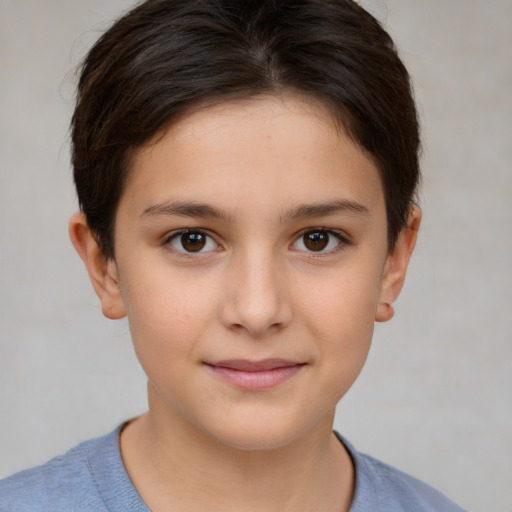 Joyful white child female with short  brown hair and brown eyes