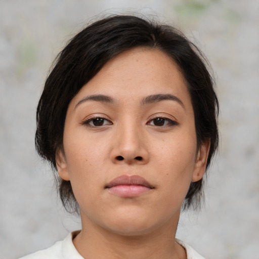 Neutral asian young-adult female with medium  brown hair and brown eyes