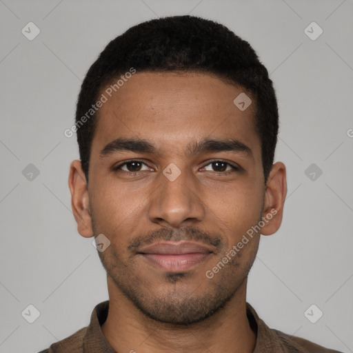 Joyful black young-adult male with short  brown hair and brown eyes