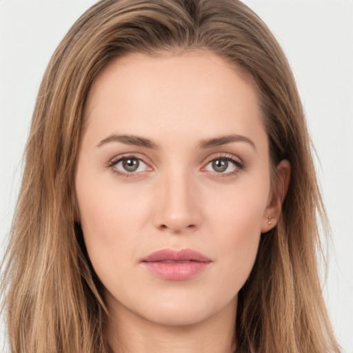 Neutral white young-adult female with long  brown hair and brown eyes