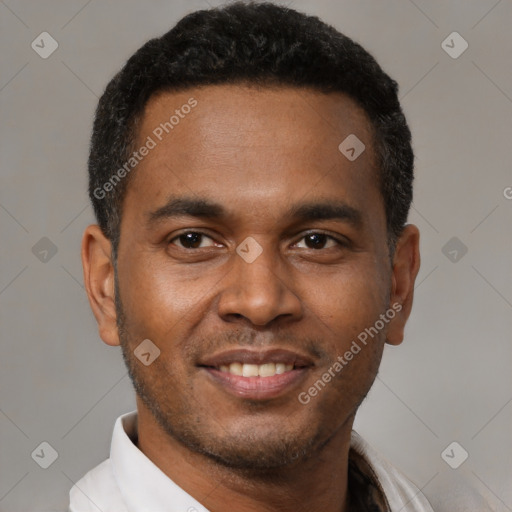 Joyful latino young-adult male with short  black hair and brown eyes