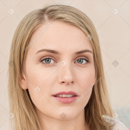 Joyful white young-adult female with long  brown hair and blue eyes