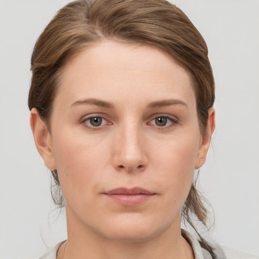 Neutral white young-adult female with medium  brown hair and grey eyes