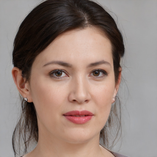Joyful white young-adult female with medium  brown hair and brown eyes
