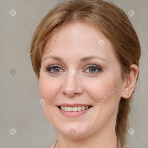 Joyful white young-adult female with medium  brown hair and blue eyes