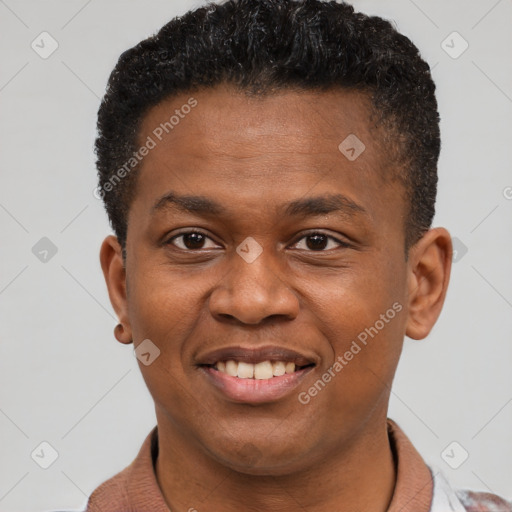 Joyful black young-adult male with short  brown hair and brown eyes