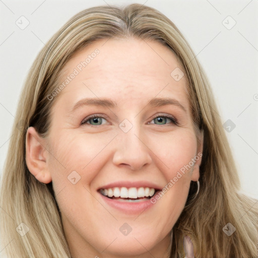 Joyful white young-adult female with long  brown hair and blue eyes