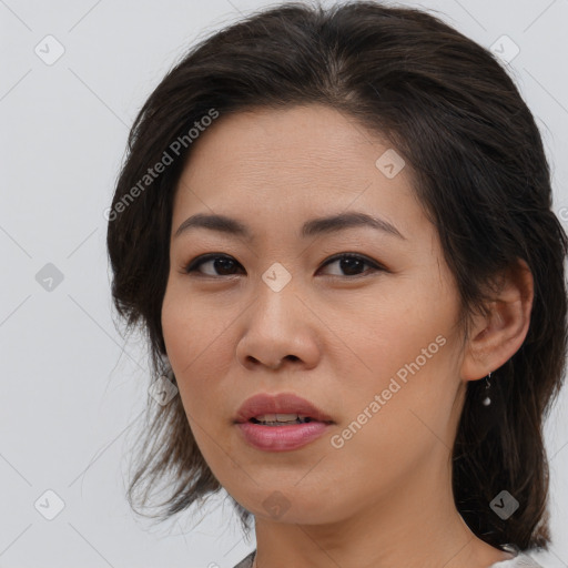 Joyful asian young-adult female with medium  brown hair and brown eyes