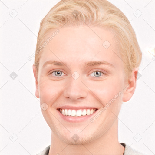 Joyful white young-adult female with short  brown hair and blue eyes