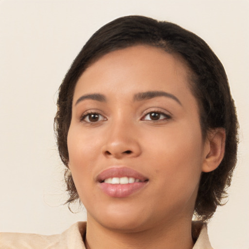 Joyful white young-adult female with medium  brown hair and brown eyes