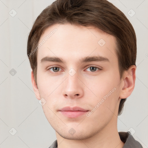 Neutral white young-adult male with short  brown hair and grey eyes