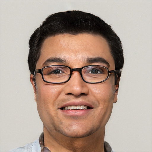 Joyful white young-adult male with short  black hair and brown eyes