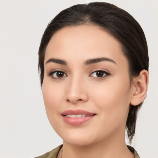 Joyful white young-adult female with medium  brown hair and brown eyes