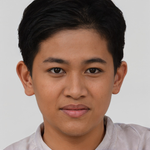Joyful latino young-adult male with short  brown hair and brown eyes