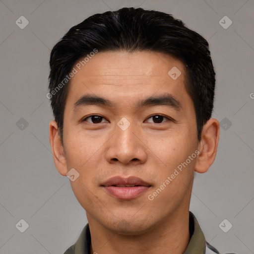 Joyful asian young-adult male with short  black hair and brown eyes