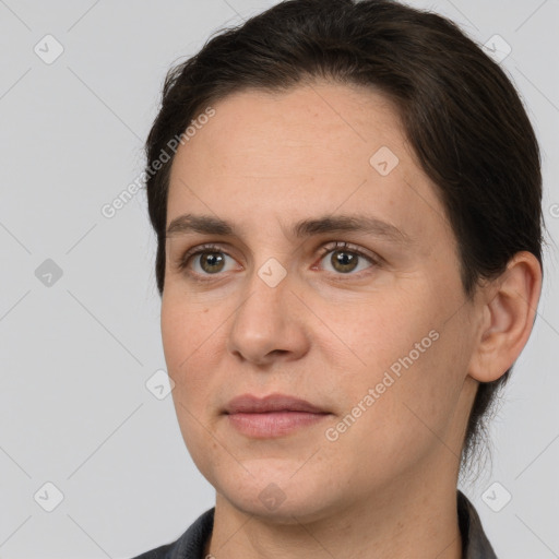 Joyful white adult female with short  brown hair and brown eyes