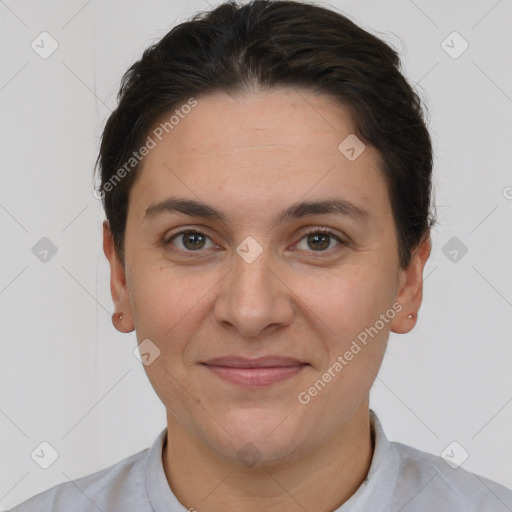 Joyful white adult female with short  brown hair and brown eyes