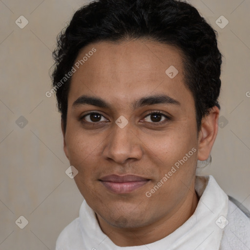 Joyful latino young-adult male with short  brown hair and brown eyes