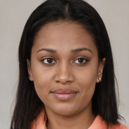 Joyful latino young-adult female with long  brown hair and brown eyes