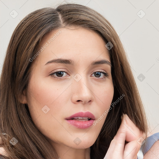 Neutral white young-adult female with long  brown hair and brown eyes