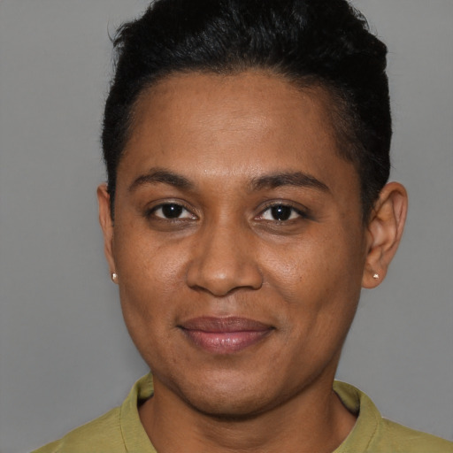 Joyful black young-adult female with short  brown hair and brown eyes