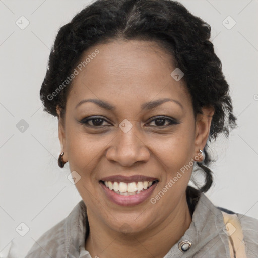 Joyful black adult female with short  brown hair and brown eyes