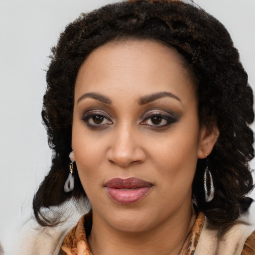 Joyful black young-adult female with medium  black hair and brown eyes