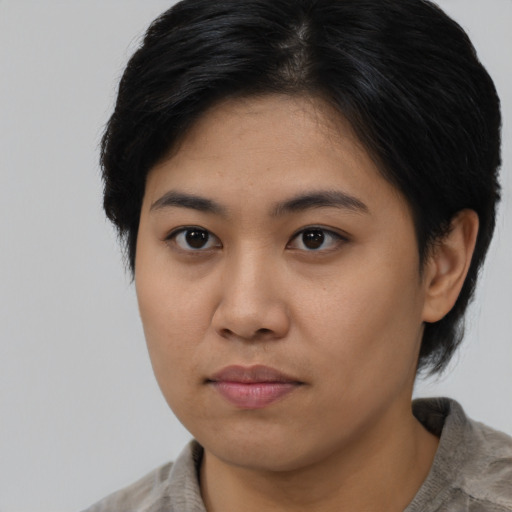 Neutral asian young-adult female with medium  brown hair and brown eyes