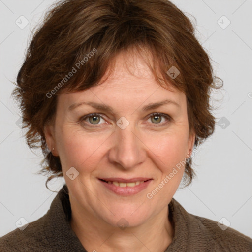 Joyful white adult female with medium  brown hair and blue eyes