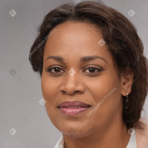 Joyful black young-adult female with medium  brown hair and brown eyes