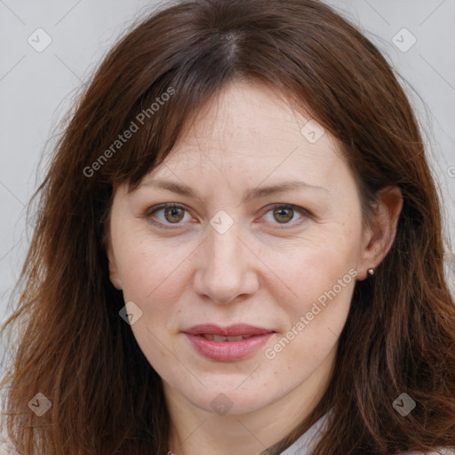 Joyful white adult female with long  brown hair and brown eyes