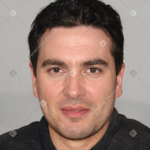 Joyful white adult male with short  black hair and brown eyes