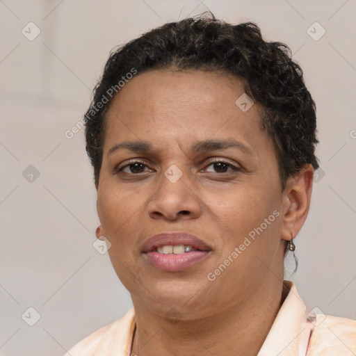 Joyful latino young-adult female with short  brown hair and brown eyes