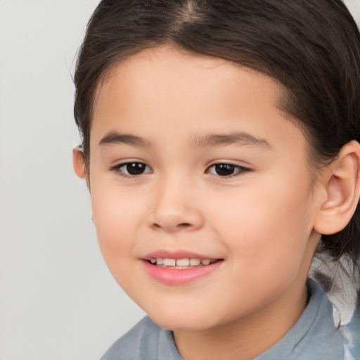 Joyful white child female with short  brown hair and brown eyes