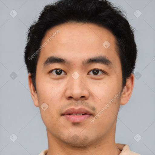 Joyful white young-adult male with short  black hair and brown eyes