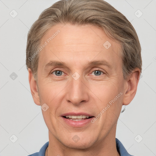 Joyful white adult male with short  brown hair and grey eyes