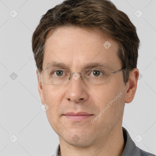 Joyful white adult male with short  brown hair and grey eyes