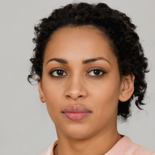Neutral latino young-adult female with long  black hair and brown eyes