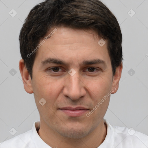 Joyful white adult male with short  brown hair and brown eyes